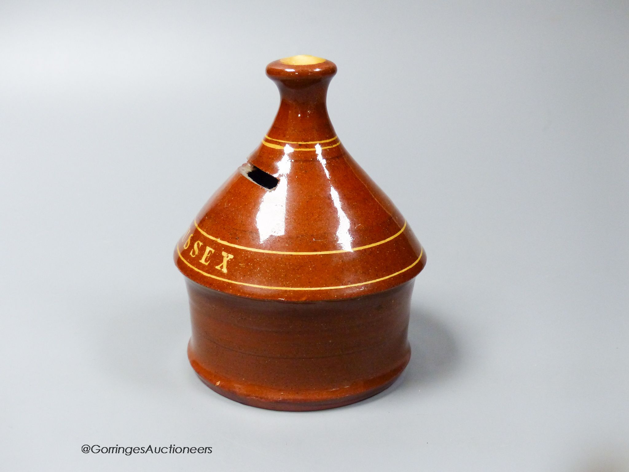 A Dickerware skep shaped money box, inscribed 